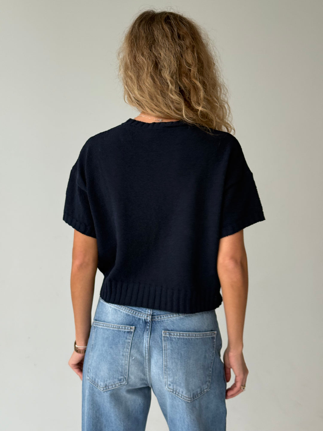 Adīts kokvilnas džemperis ar uzrakstu