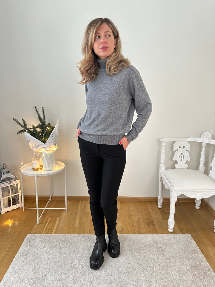 Slim knitted wool sweater with a high collar