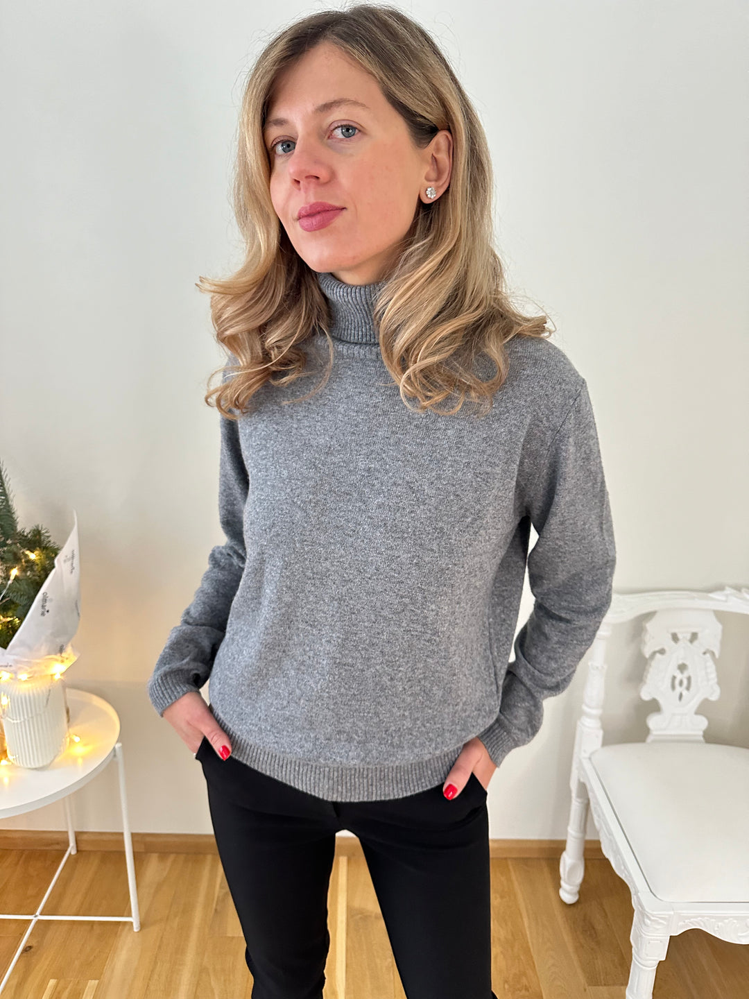 Slim knitted wool sweater with a high collar