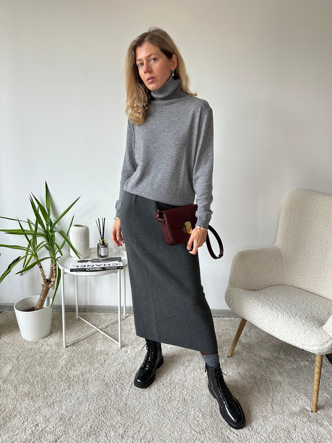 Slim knitted wool sweater with a high collar