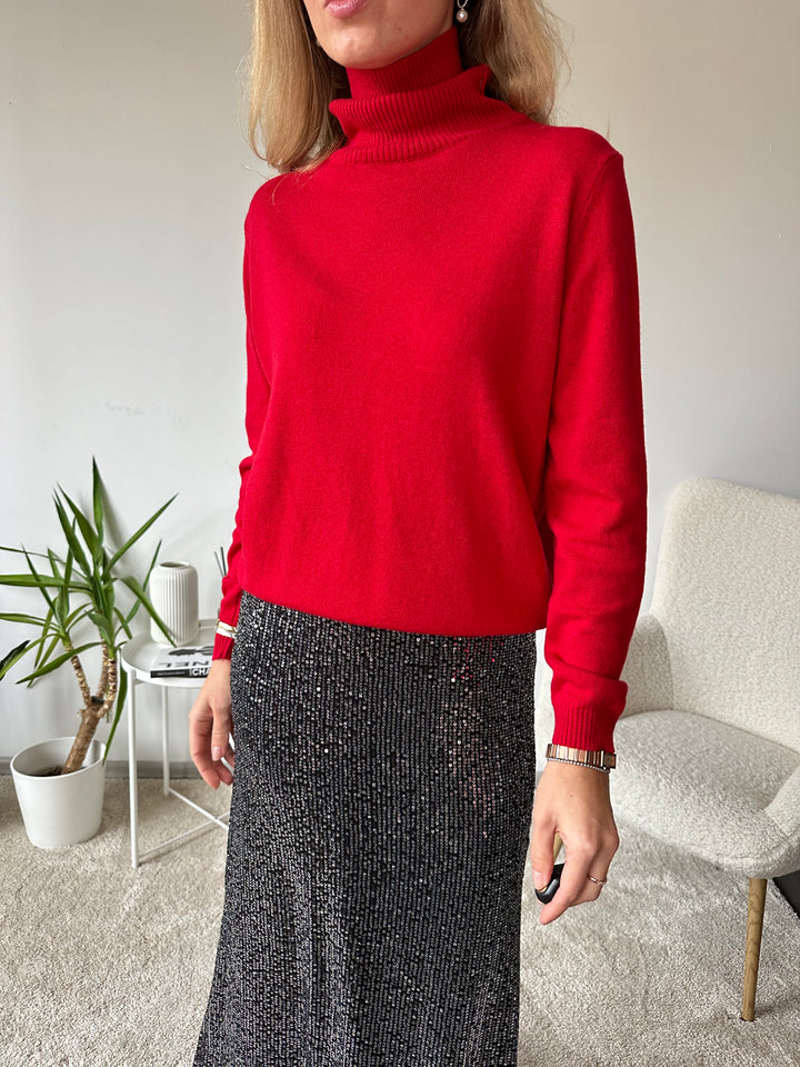 Slim knitted wool sweater with a high collar