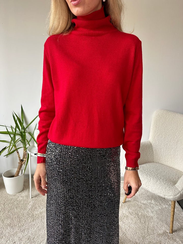 Slim knitted wool sweater with a high collar