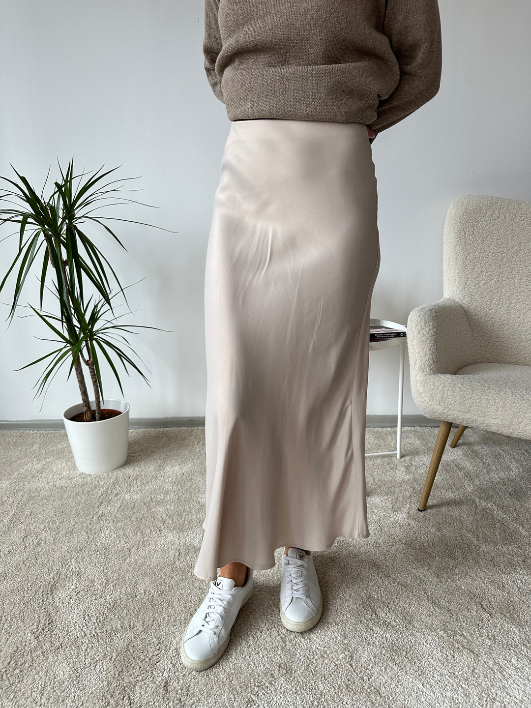 Sweater with a slip skirt and sneakers for casual work