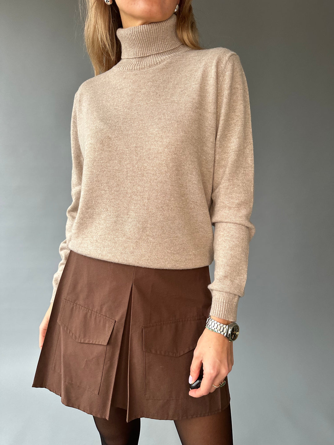 Slim knitted wool sweater with a high collar