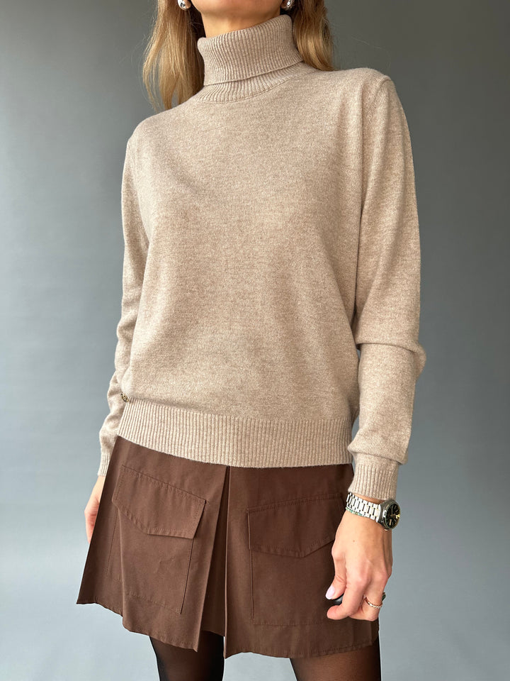 Slim knitted wool sweater with a high collar