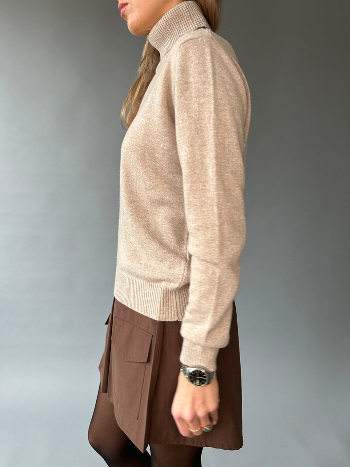 Slim knitted wool sweater with a high collar