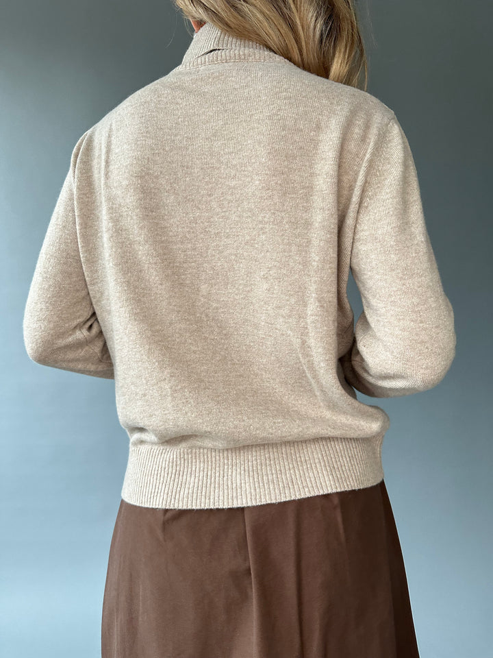 Slim knitted wool sweater with a high collar